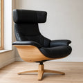 Fauteuil pivotant cuir noir piètement chêne